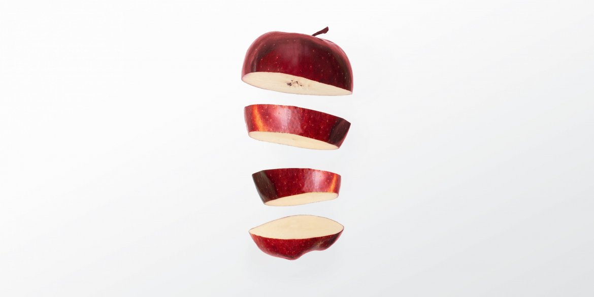 Sliced apple in mid air