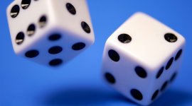 two white die on blue surface
