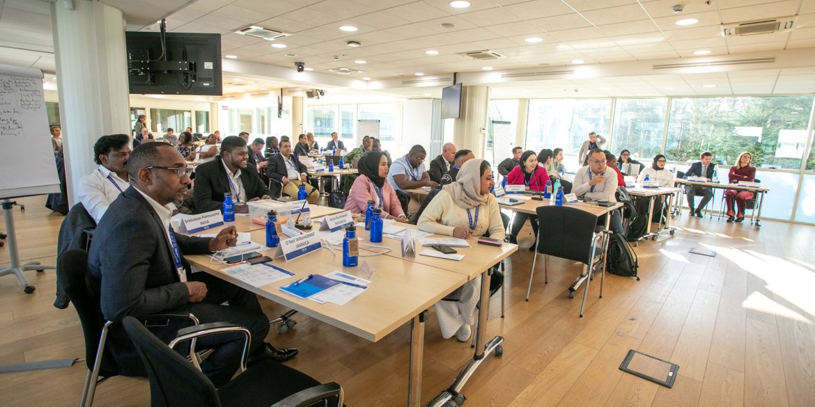 participants in a classroom listening to a speaker