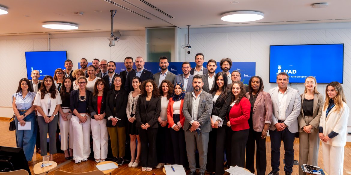 A group of diplomats and officials posing for a photo during an institutional visit to the International Fund for Agricultural Development (IFAD)