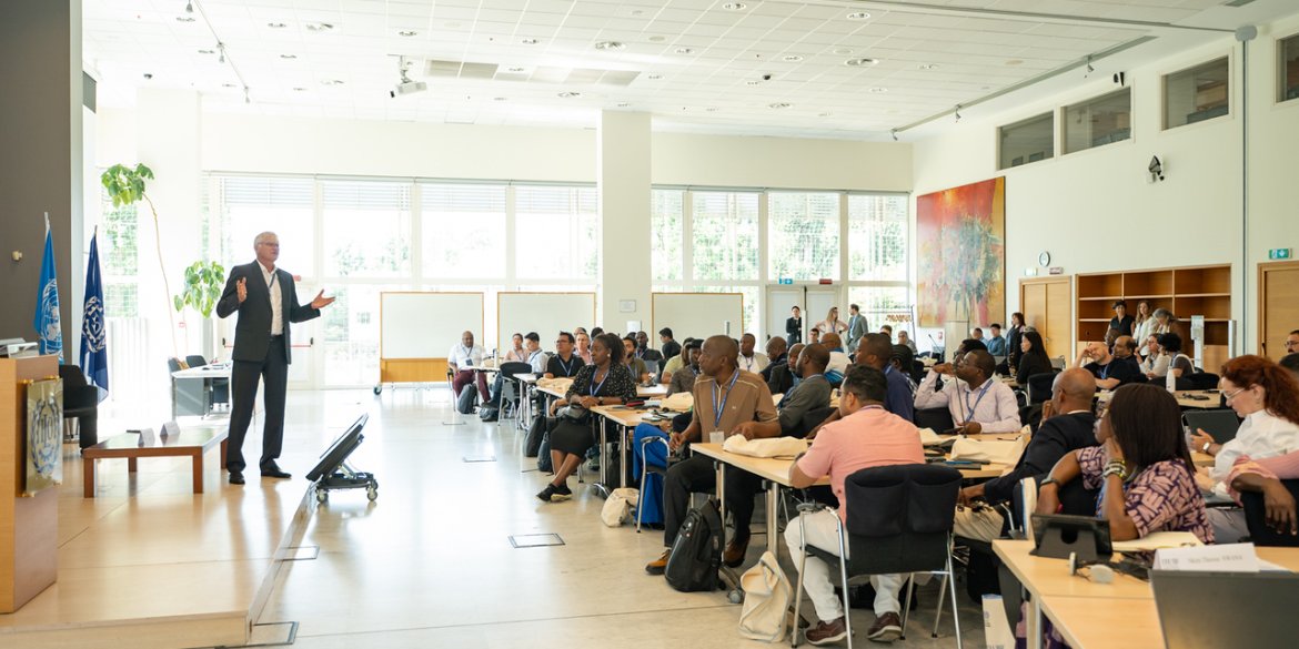 Presenter addressing participants during a training session.