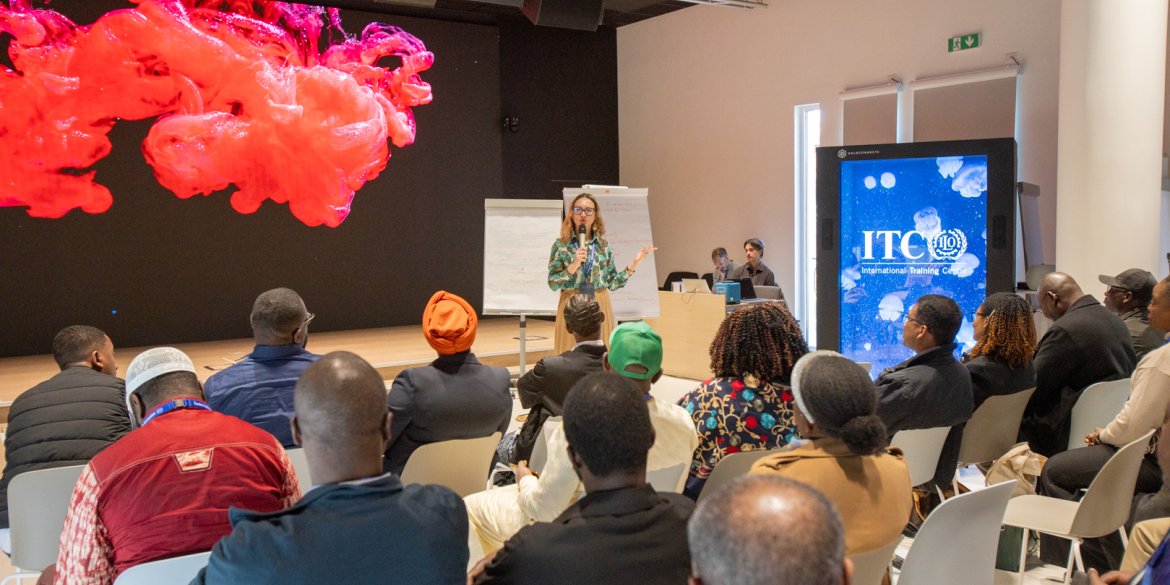 Faciliator addresses seated participants