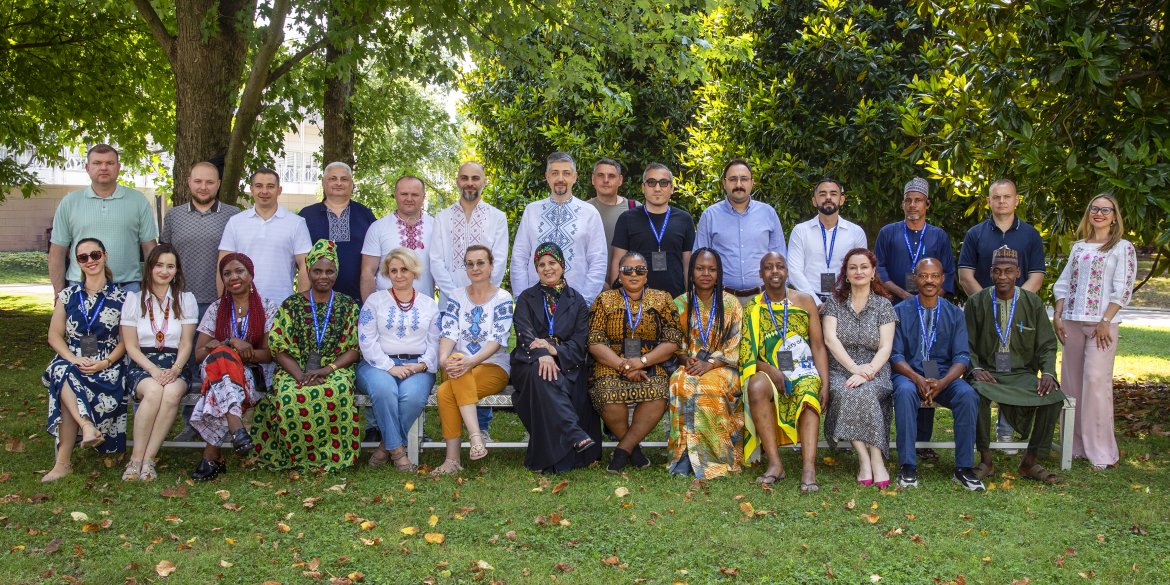 Diverse group of participants posing together outdoors