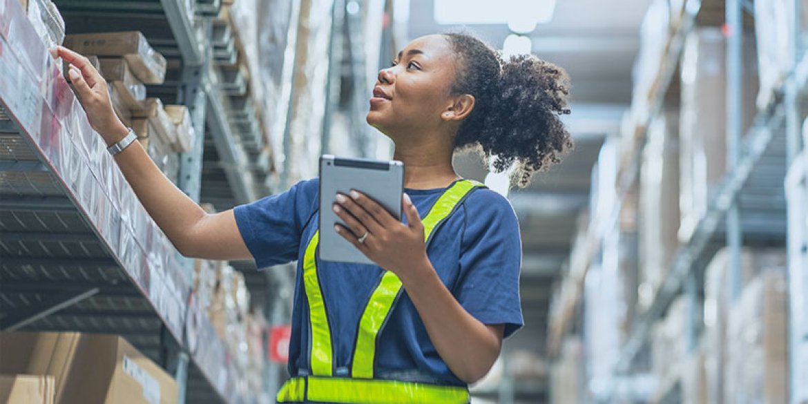 woman taking inventory in a warehouse