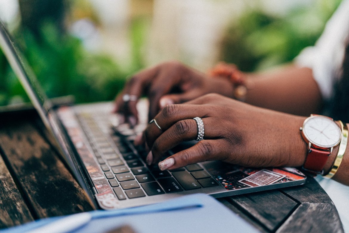 person typing on keyboard