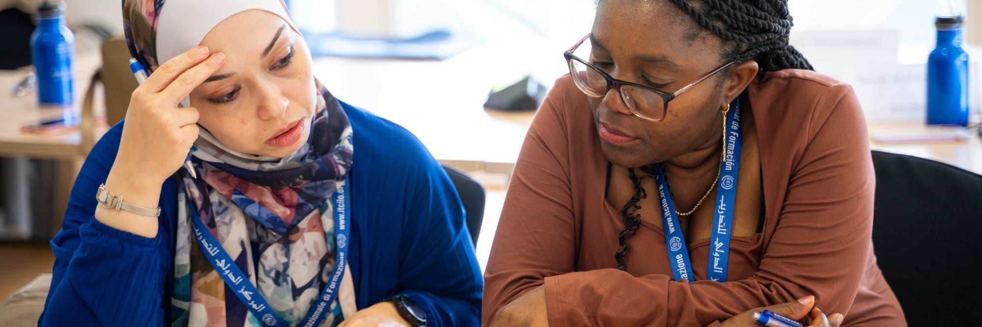 Two women participants learning together
