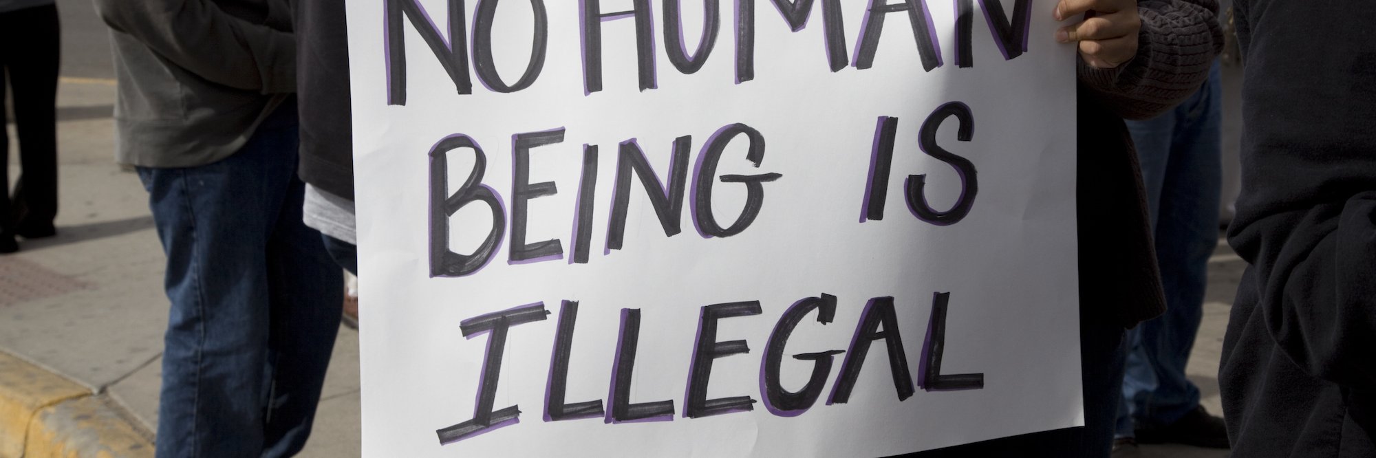 No human being is illegal banner