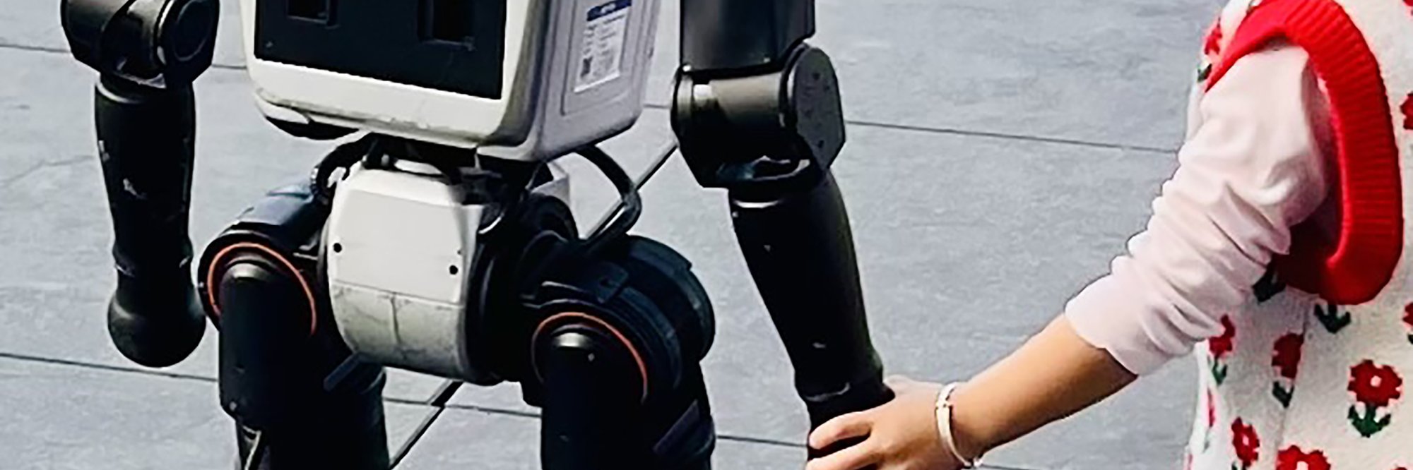 Robot holding hand child.
