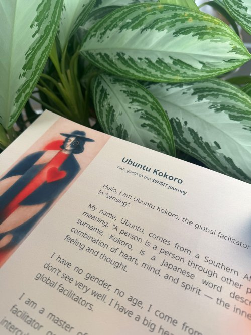 Close-up of the Ubuntu Kokoro guide from the SENSIT toolkit, featuring an illustrated character and introductory text against a backdrop of green leaves.