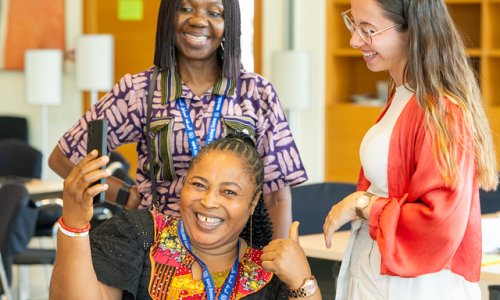 participants laughing and posing for a selfie