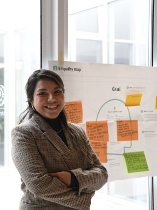 Melisa standing in front of flip chart