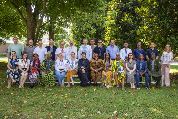 Diverse group of participants posing together outdoors