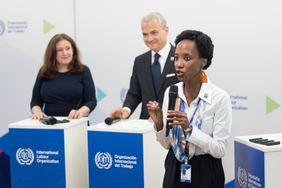 Melissa Kyeyune makes her pitch during the Innovation Scouts event presented by ITCILO Director Christophe Perrin and ILO Deputy Director-General Celeste Drake at the ILC
