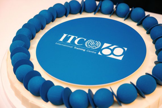 a cake with blue frosting and the itcilo logo