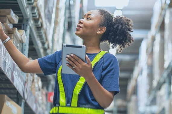 woman taking inventory in a warehouse