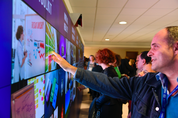 Man touching interactive video wall